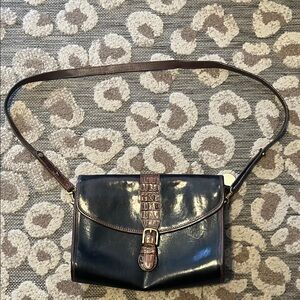 Vintage Brahmin black bag with brown trim.